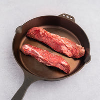 raw hanger steak in cast iron skillet 