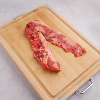 outside skirt steak raw on a cutting board 