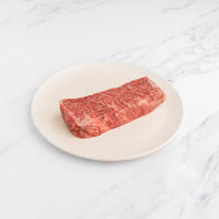 raw SRF Black® zabuton steak on white plate 