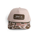 Beige cap with camouflage brim and Snake River Farms logo on a white background