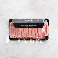 Packaged smoked Canadian bacon from Snake River Farms on a gray surface
