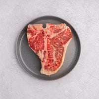 raw SRF Gold® Porterhouse steak on plate |SRF Gold® 