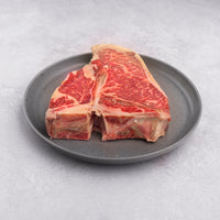 raw SRF Gold® Porterhouse steak on plate |SRF Gold® 