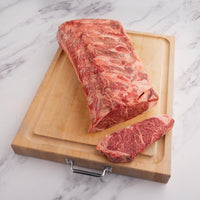 highly marbles striploin roast on cutting board 