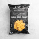 Bag of Snake River Farms kettle chips cooked in Wagyu beef tallow on a light gray background