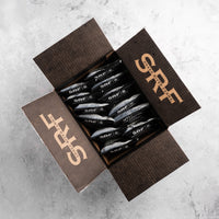 Open box of SRF tallow kettle chips on a gray surface