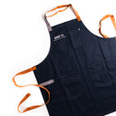Blue apron with leather straps on a white background