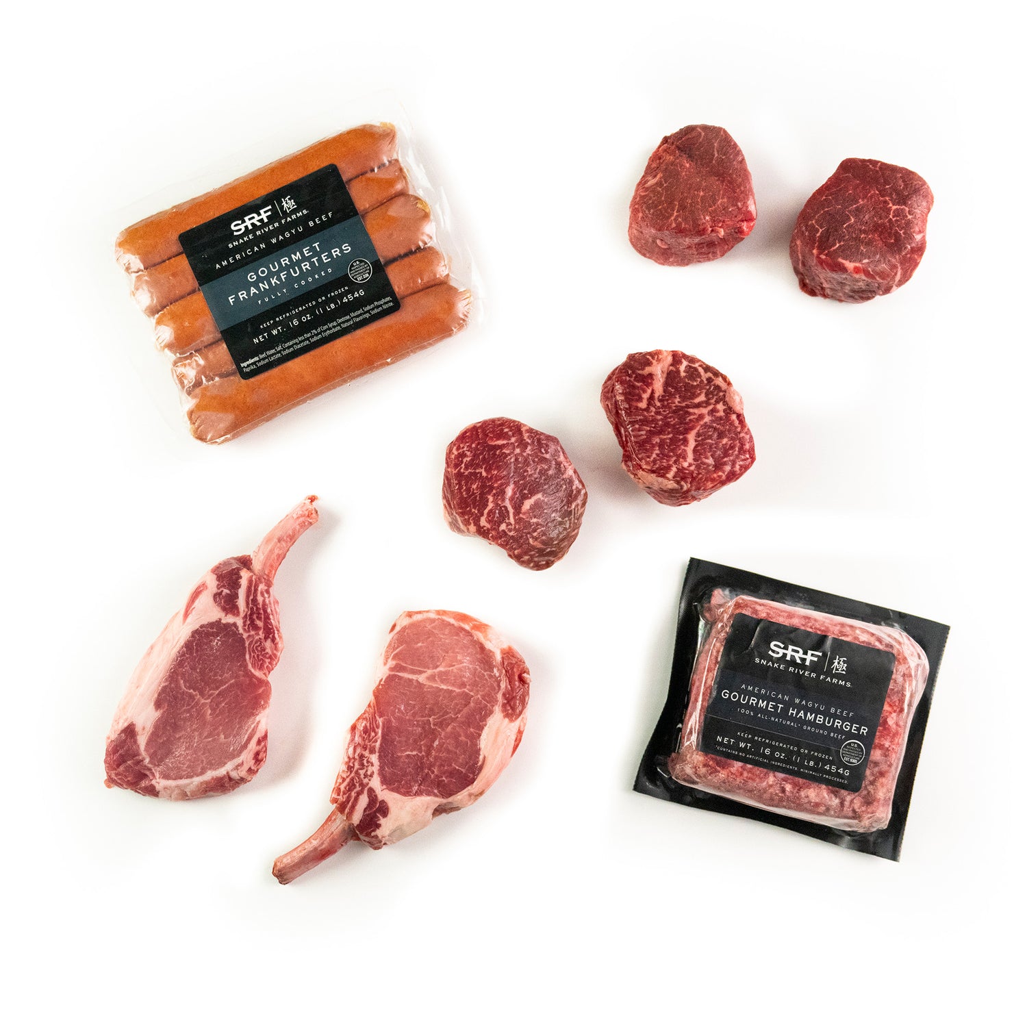 Assortment of fresh meats including two Kurobuta Frenched Pork Chops, American Wagyu Ground Beef, a SRF Gold® Filet Mignon, American Wagyu Hot Dogs, and two SRF Gold® Ribeye Filets, all displayed on a white background.
