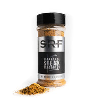 Jar of Signature Steak Seasoning with visible branding on a white background