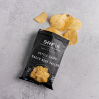 Wagyu Beef Tallow Kettle chips with a black SRF packaging on a gray surface