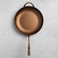 Bronze farmhouse skillet on a light gray background