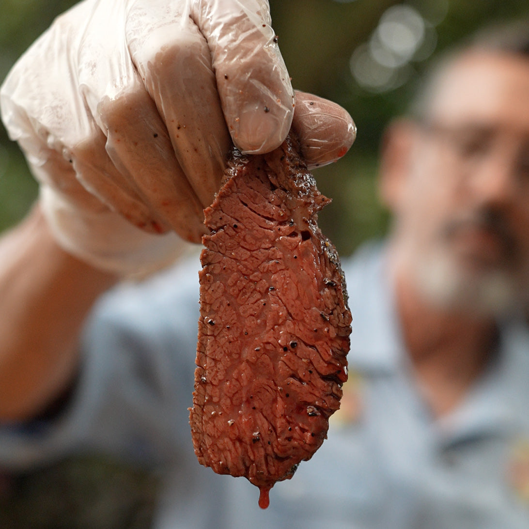Person holding a  piece of Tr Tip outdoors
