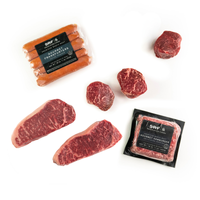 Assorted cuts of raw meat with SRF packaging on a white background