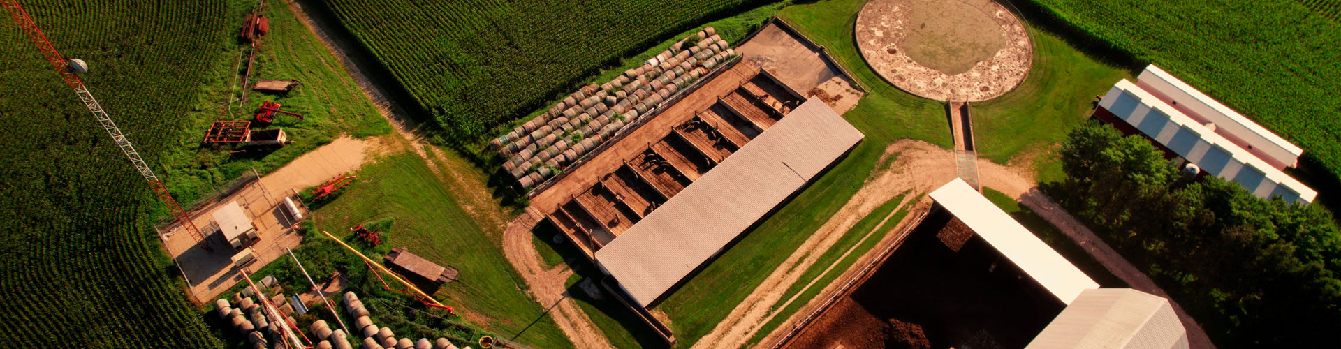 Aerial view of a hog farm with buildings and roads.