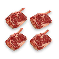 four cowboy steaks raw 