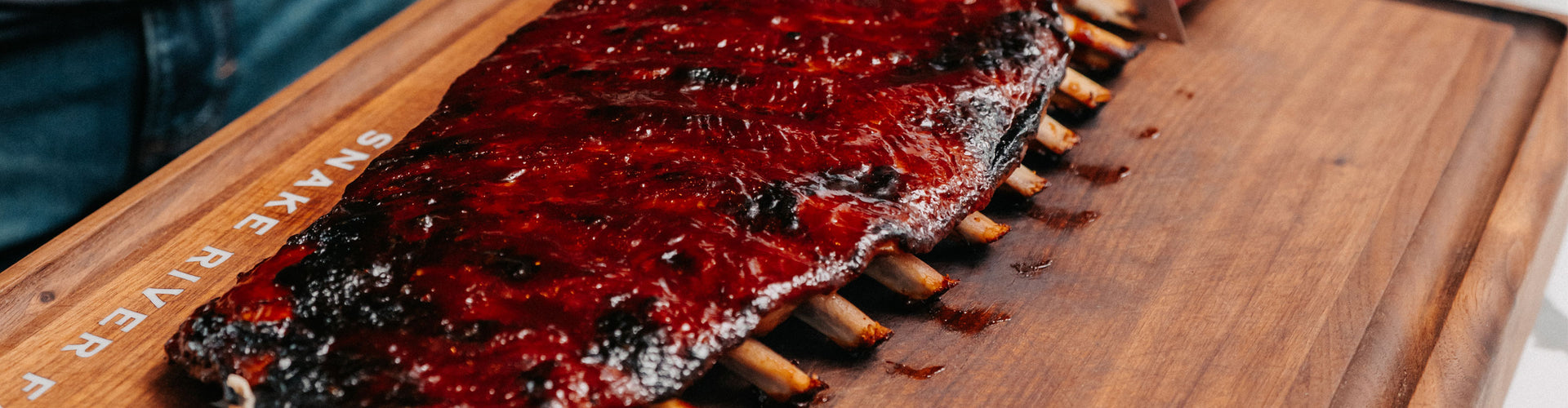 glazed spare ribs up close on a cutting board