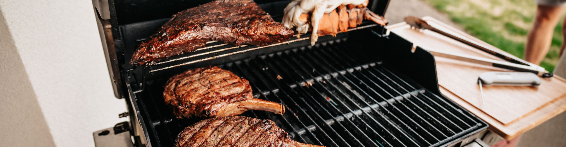 Grilling meat on a barbecue with a focus on the food.